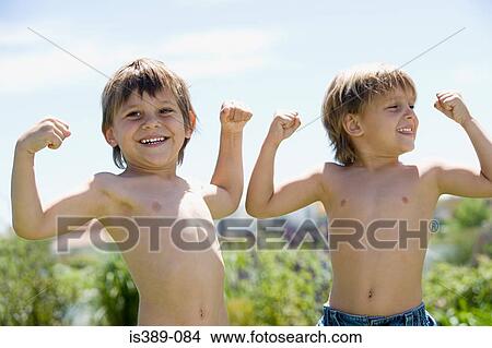 Boys flexing muscles View Large Photo Image Picture - Boys flexing muscles. Fotosearch