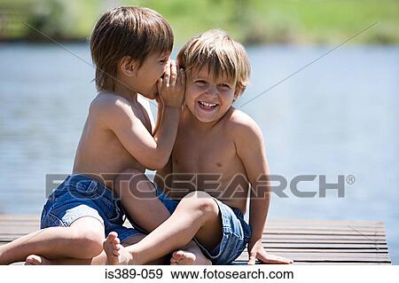 Boys whispering View Large Photo Image Stock Photo - Boys whispering. Fotosearch
