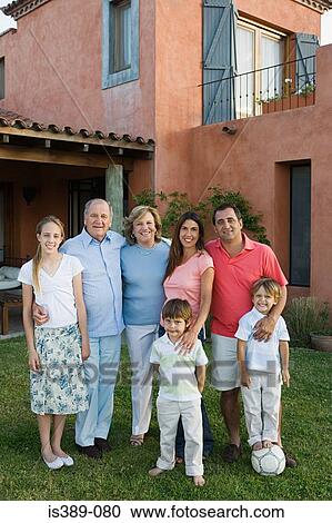 Family standing outside house View Large Photo Image Stock Image - Family standing outside house. Fotosearch