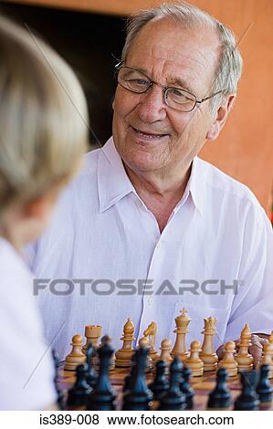 Grandfather and grandson playing chess View Large Photo Image Stock Photo - Grandfather and grandson playing chess. Fotosearch