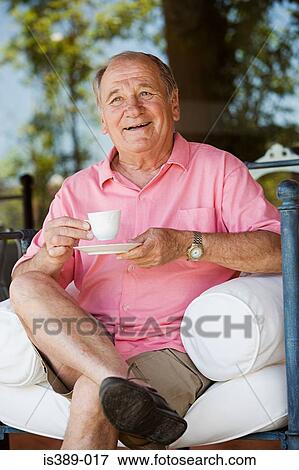 Stock Photo - Senior man drinking tea. Fotosearch