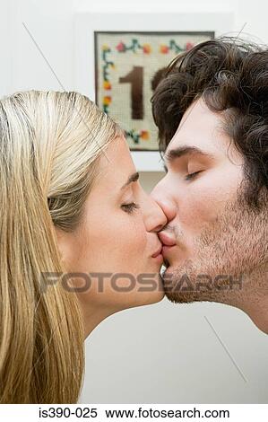 Stock Photography - Couple kissing. Fotosearch