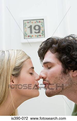 Couple touching noses View Large Photo Image Stock Image - Couple touching noses. Fotosearch