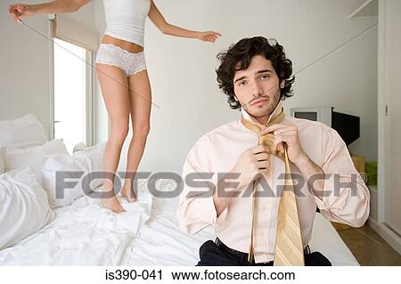Man getting dressed View Large Photo Image Stock Image - Man getting dressed. Fotosearch