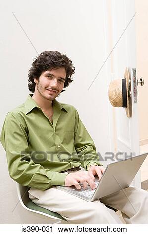 Man working on laptop View Large Photo Image Stock Image - Man working on laptop. Fotosearch