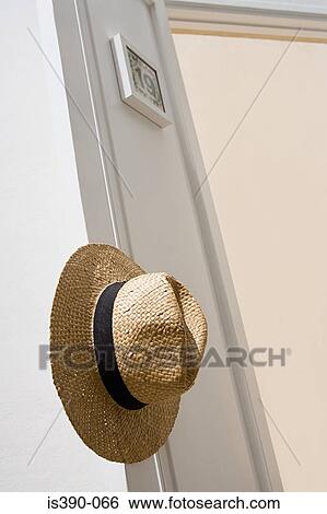 Panama hat hanging on door View Large Photo Image Stock Photograph - Panama hat hanging on door. Fotosearch