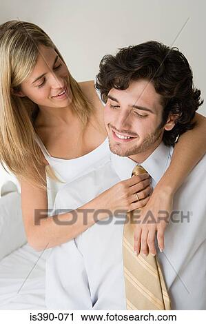 Woman adjusting mans tie View Large Photo Image Stock Image - Woman adjusting mans tie. Fotosearch