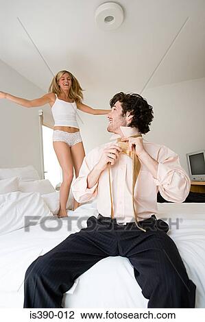 Woman jumping on bed View Large Photo Image Stock Image - Woman jumping on bed . Fotosearch