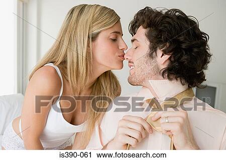 Woman kissing man on nose View Large Photo Image Stock Image - Woman kissing man on nose. Fotosearch