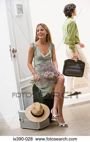 Woman sat on suitcase View Large Photo Image Stock Photo - Woman sat on suitcase. Fotosearch