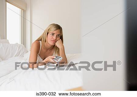 Woman watching television View Large Photo Image Stock Image - Woman watching television. Fotosearch