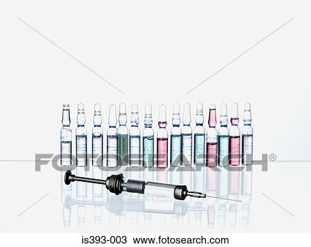 Stock Image - Syringe and medicine bottles. Fotosearch