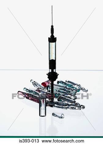Stock Image - Syringe and medicine. Fotosearch