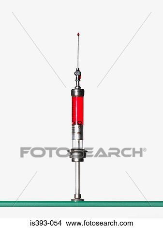 Syringe containing red liquid View Large Photo Image Picture - Syringe containing red liquid. Fotosearch