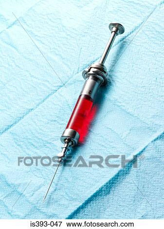 Syringe containing red liquid View Large Photo Image Stock Photo - Syringe containing red liquid. Fotosearch