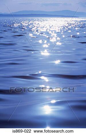 Sunlight reflecting on the sea View Large Photo Image Stock Image - Sunlight reflecting on the sea. Fotosearch