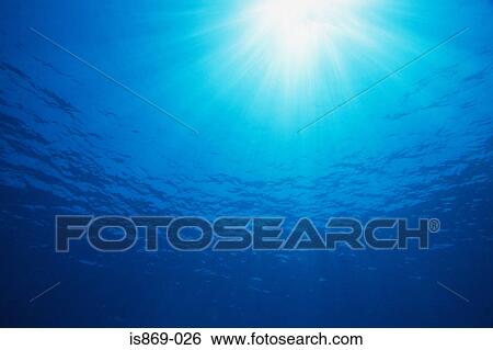 Stock Photograph - Sunlight through the sea. Fotosearch