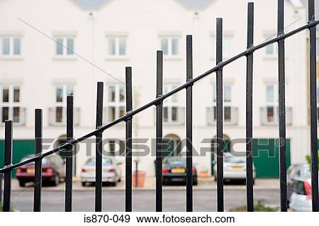 Cars parked outside houses View Large Photo Image Stock Photo - Cars parked outside houses. Fotosearch