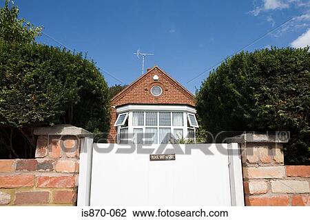Gate and bungalow View Large Photo Image Stock Image - Gate and bungalow. Fotosearch