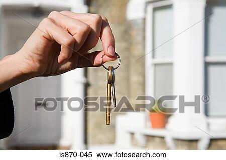 Person with keys to house View Large Photo Image Stock Photography - Person with keys to house. Fotosearch