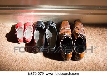 Shoes of a family View Large Photo Image Stock Photo - Shoes of a family. Fotosearch