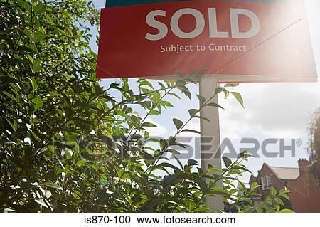 Stock Image - Sold sign in sunlight. Fotosearch