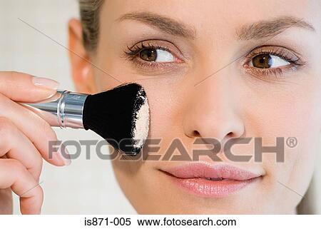 Woman applying face powder View Large Photo Image Stock Photography - Woman applying face powder. Fotosearch