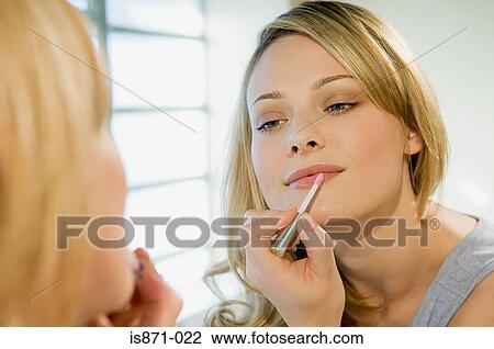 Woman applying lipgloss View Large Photo Image Stock Image - Woman applying lipgloss. Fotosearch