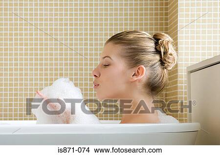 Woman bathing View Large Photo Image Picture - Woman bathing. Fotosearch
