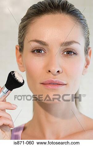 Woman holding make up brush View Large Photo Image Stock Image - Woman holding make up brush. Fotosearch