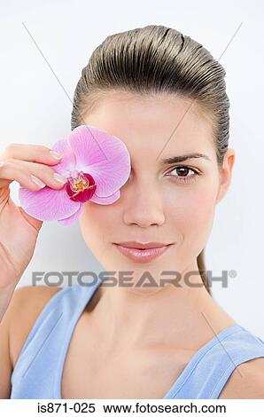 Woman holding orchid View Large Photo Image Stock Photography - Woman holding orchid. Fotosearch