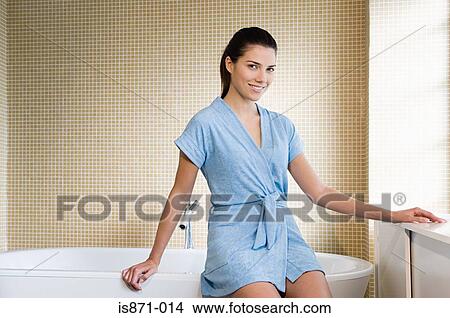 Woman sat on bath View Large Photo Image Picture - Woman sat on bath. Fotosearch