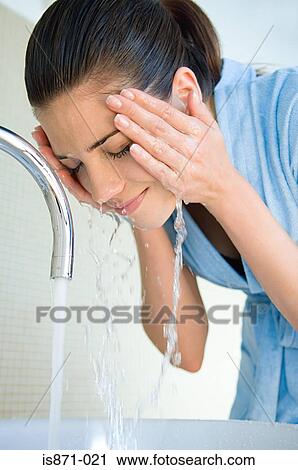 Woman washing face View Large Photo Image Stock Image - Woman washing face. Fotosearch