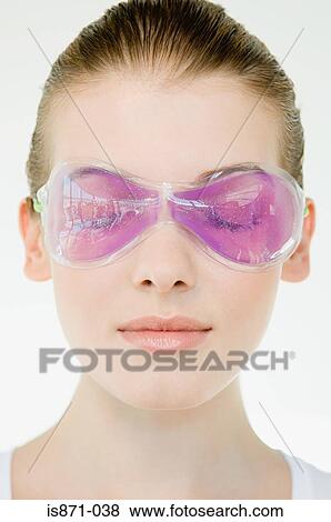 Stock Photo - Woman wearing eye mask. Fotosearch