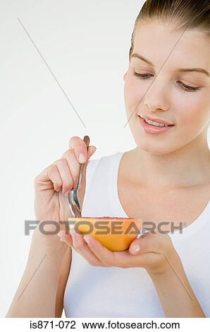 Woman with a grapefruit View Large Photo Image Stock Image - Woman with a grapefruit. Fotosearch