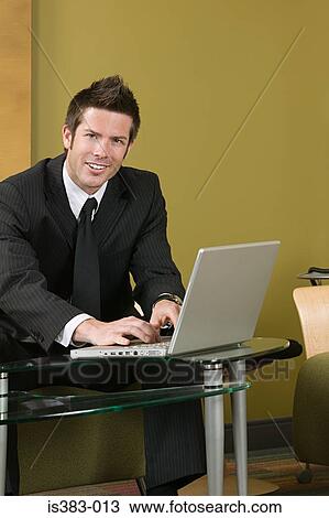 Businessman using laptop View Large Photo Image Stock Image - Businessman using laptop . Fotosearch