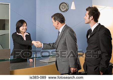 Stock Photo - Businesspeople greeting. Fotosearch