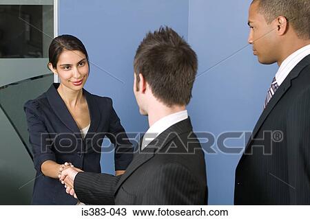 Stock Image - Businesspeople shaking hands. Fotosearch