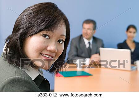 Businesswoman in meeting View Large Photo Image Stock Image - Businesswoman in meeting. Fotosearch