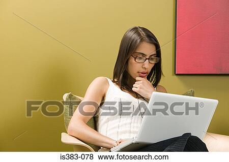 Businesswoman using laptop View Large Photo Image Stock Photo - Businesswoman using laptop. Fotosearch