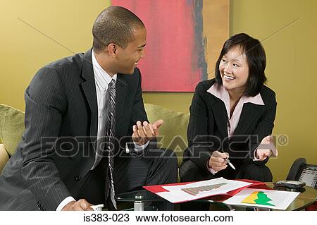 Stock Image - Colleagues talking. Fotosearch