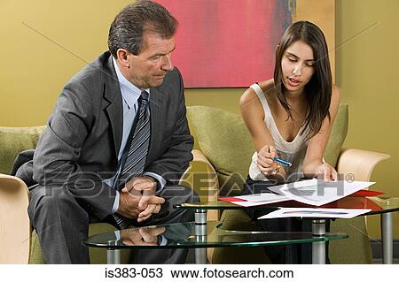 Colleagues talking View Large Photo Image Stock Image - Colleagues talking. Fotosearch