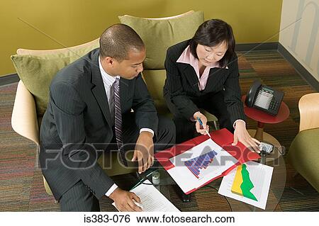 Colleagues talking View Large Photo Image Stock Photograph - Colleagues talking. Fotosearch