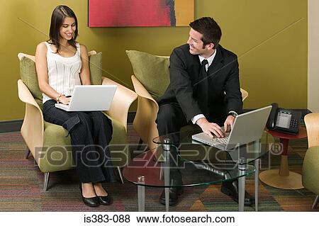 Colleagues using laptops View Large Photo Image Stock Photo - Colleagues using laptops. Fotosearch