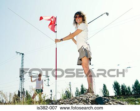 Stock Photo - Female golfers. Fotosearch