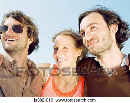 Stock Image - Friends smiling. Fotosearch