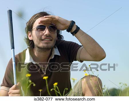 Golfer looking away View Large Photo Image Stock Photo - Golfer looking away. Fotosearch
