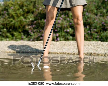 Woman playing golf in stream View Large Photo Image Stock Image - Woman playing golf in stream. Fotosearch