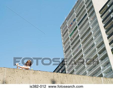 Woman playing urban golf View Large Photo Image Stock Image - Woman playing urban golf. Fotosearch