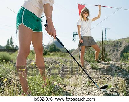 Women playing golf on wasteland View Large Photo Image Stock Photograph - Women playing golf on wasteland. Fotosearch